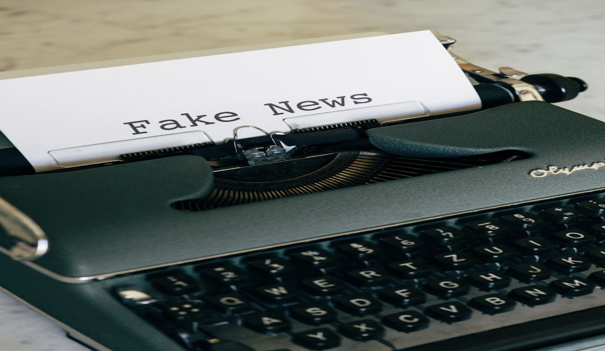 A typewriter with the words “Fake news” written on it.